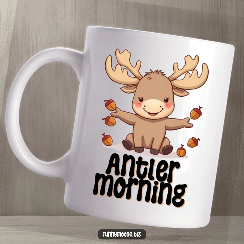 Funny kawaii moose with large antlers joyfully juggling tiny acorns, depicted with a happy expression on a mug.