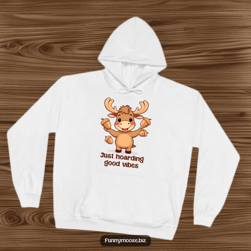 Funny Kawaii moose hoodie, performing an impressive juggle of three large acorns with a gleeful, wide-mouthed smile.