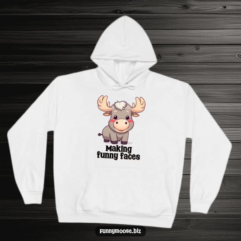 Funny Kawaii Moose Hoodie: A cartoon moose blows a raspberry, puffed cheeks, cozy apparel for playful souls.