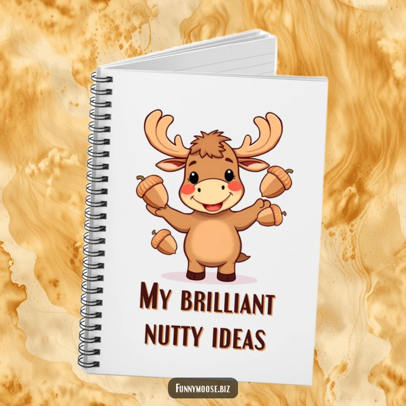 Funny Kawaii moose notebook, front cover shows a moose juggling three large acorns with an ecstatic smile, creative journal.