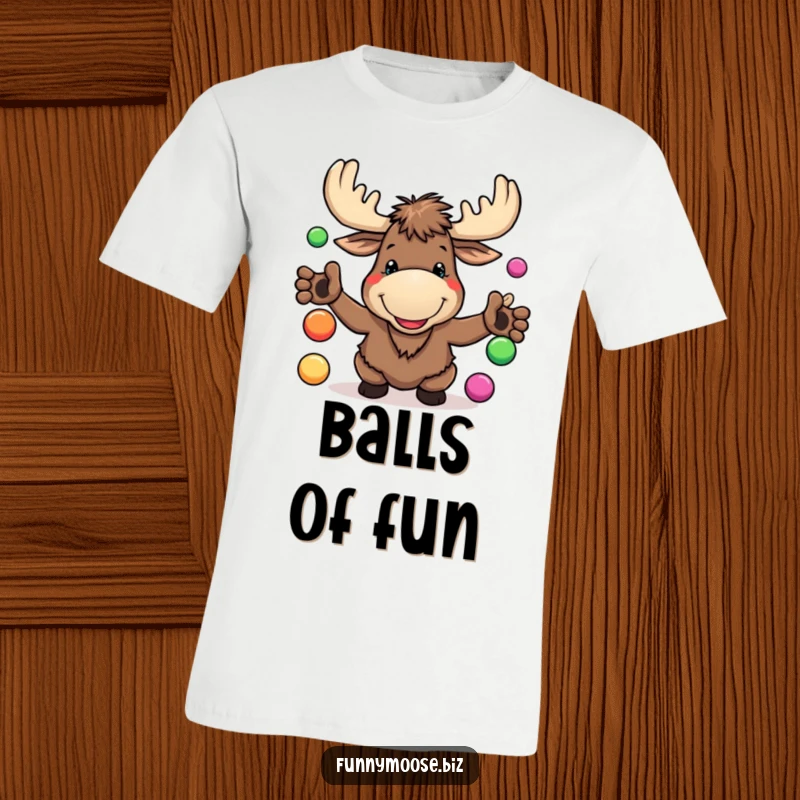 Funny Kawaii Moose T-Shirt with a goofy grin, juggling colorful balls, capturing woodland humor and playful energy.
