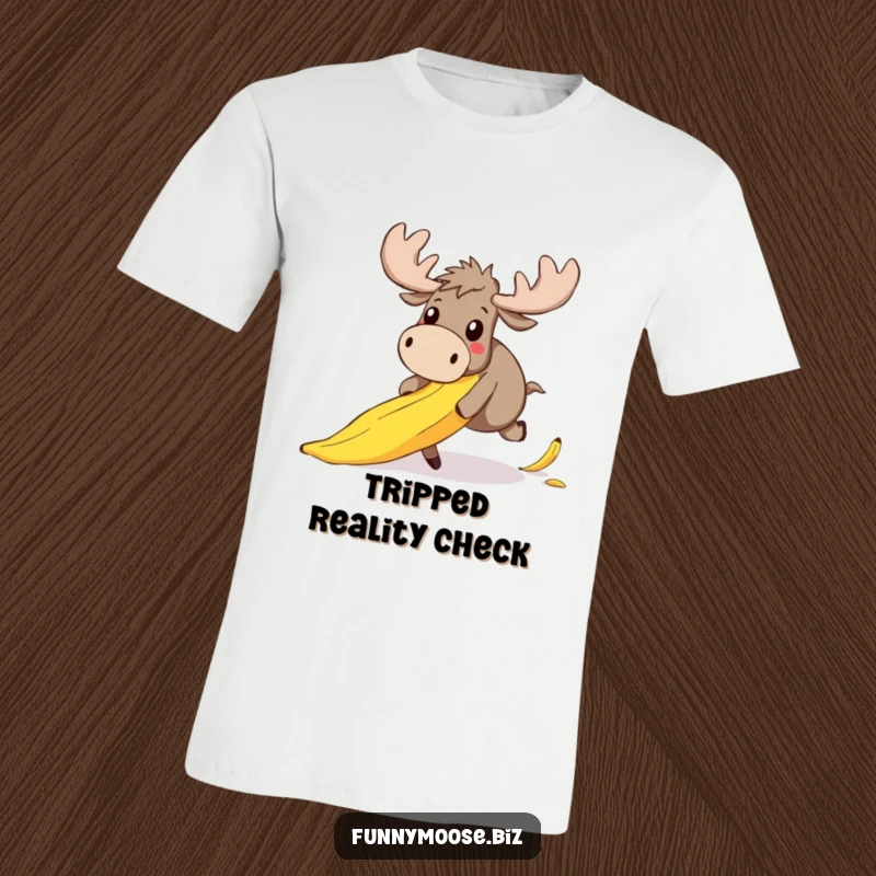 Funny t-shirt featuring a cute kawaii moose mid-fall over a slippery banana peel, its expression pure, wide-eyed surprise and shock.